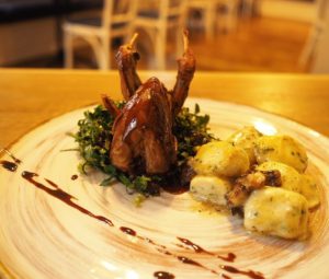 Eating local is possible with farm raised quail stuffed with preserved cherries and served with freshly made gnocchi at Bagri Restaurant in Sofia Bulgaria